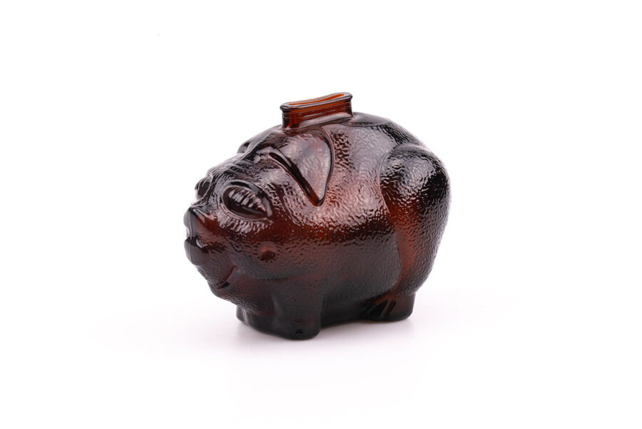 Ancienne tirelire en verre épais fumé. Elle est en forme de cochon plutôt fun.