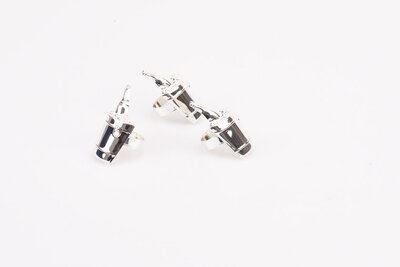 3 ronds de serviette en inox avec un motif de seau à champagne avec une bouteille dedans