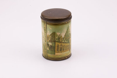 Ancienne boite en métal avec des teintes beiges et brunes de De Veurnsche Torens.